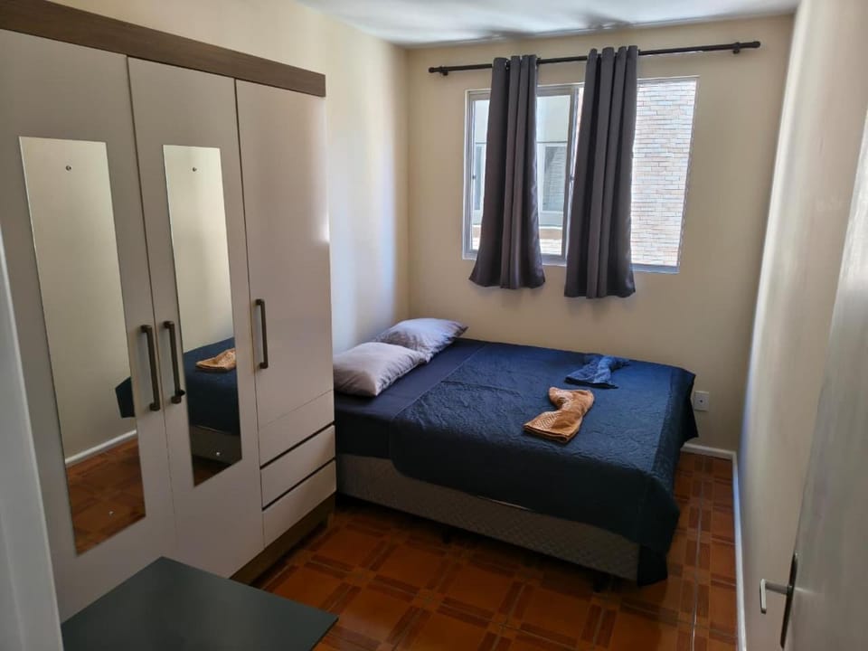 Bed, towels, wardrobe