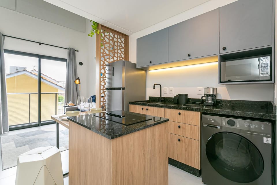 Kitchen or kitchenette, stove, toaster, washing machine, dryer