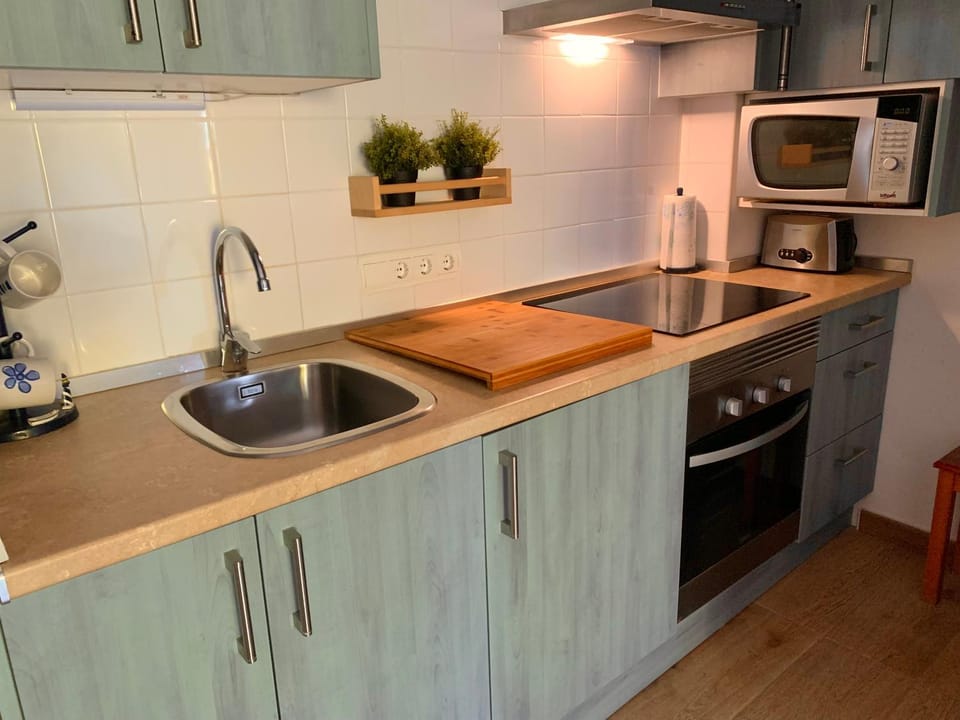 Kitchen or kitchenette, stove