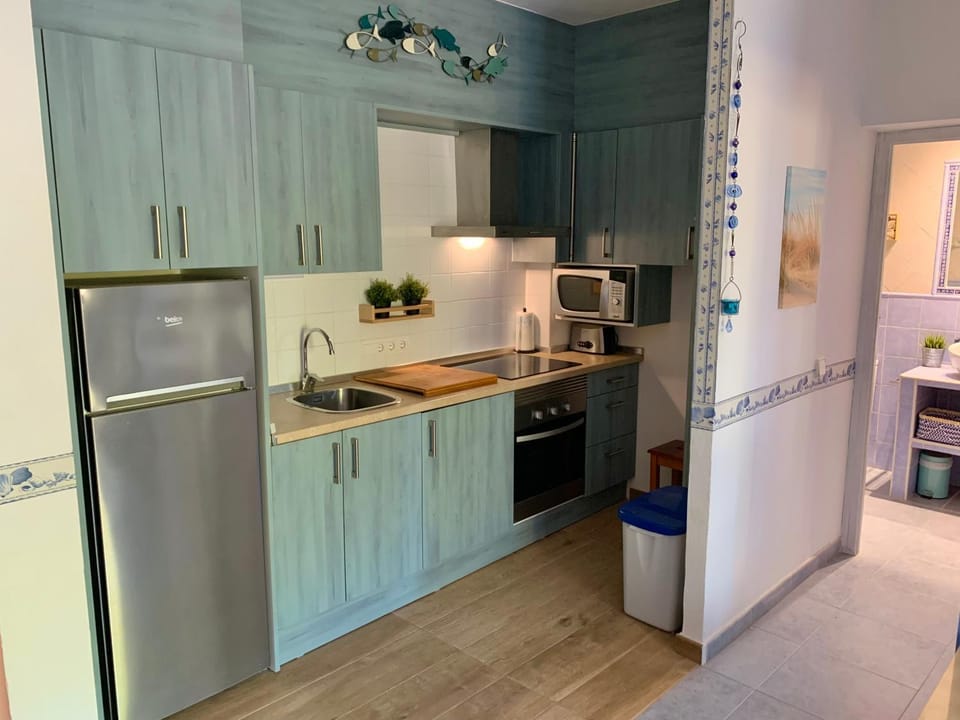 Kitchen or kitchenette, oven, stove