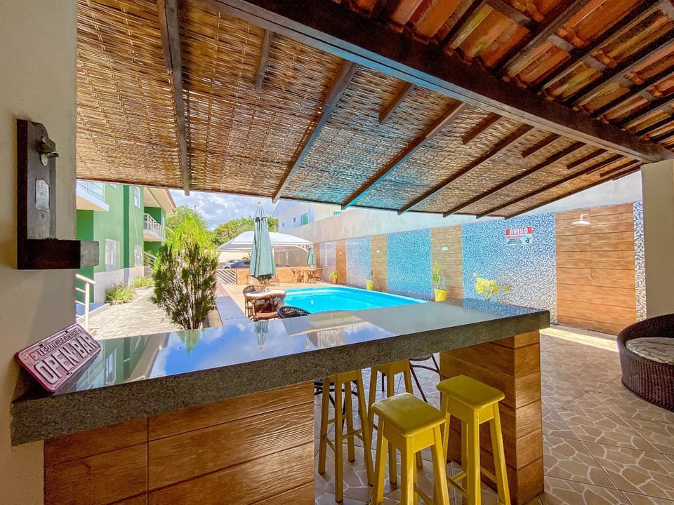 Condominium with Pool, Gourmet Area and Covered Parking 800m from Taperapuã Beach Apartment in State of Bahia