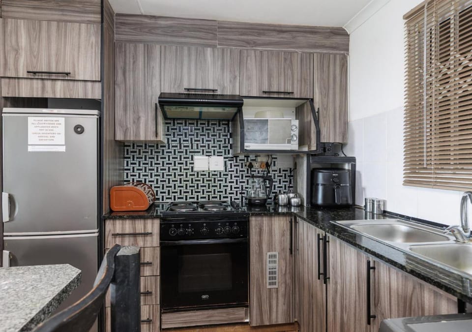 Kitchen or kitchenette, microwave, oven, stove, kitchen