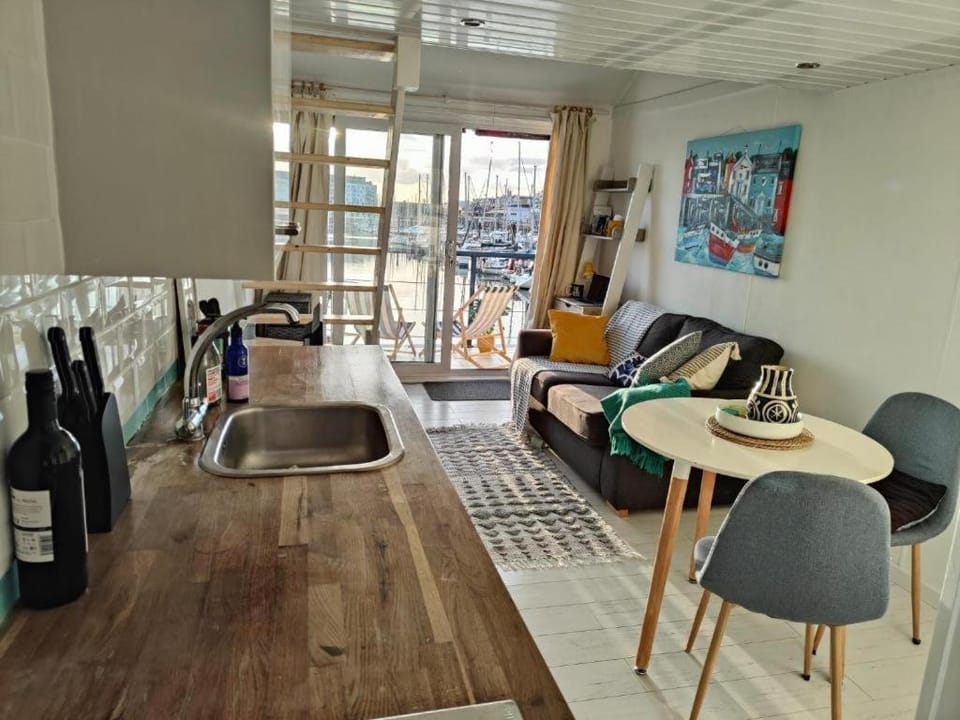 Tiny float home Brighton Docked boat in Brighton