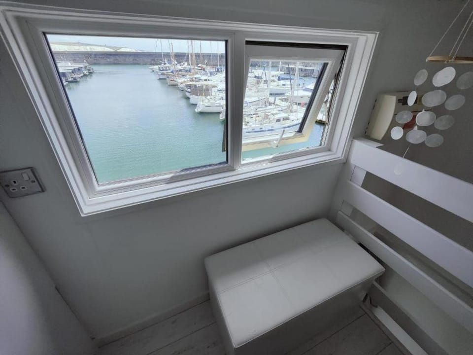 Tiny float home Brighton Docked boat in Brighton