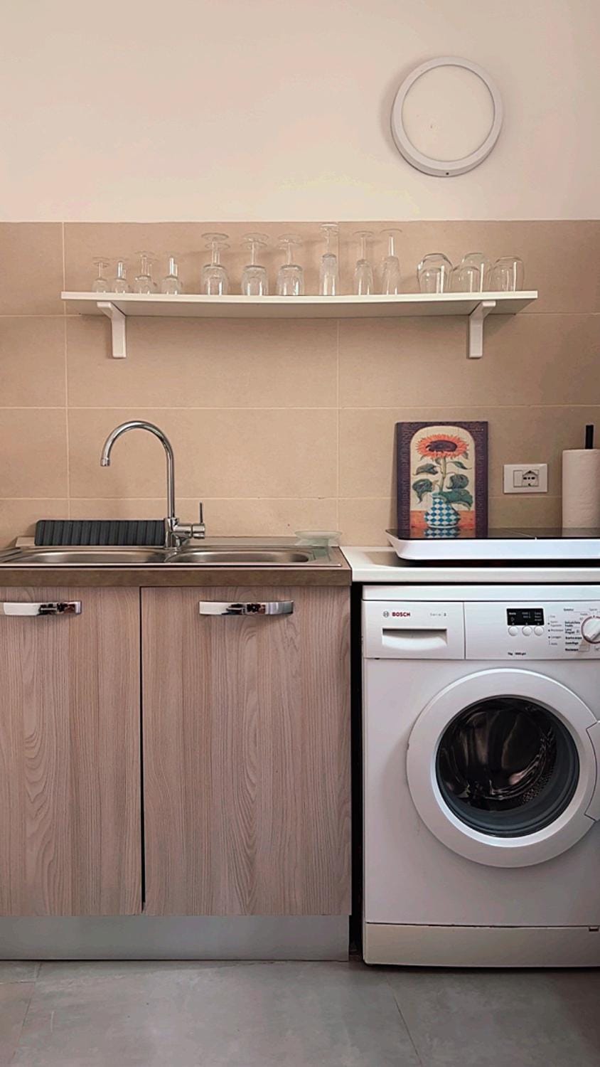 Kitchen or kitchenette, stove, washing machine