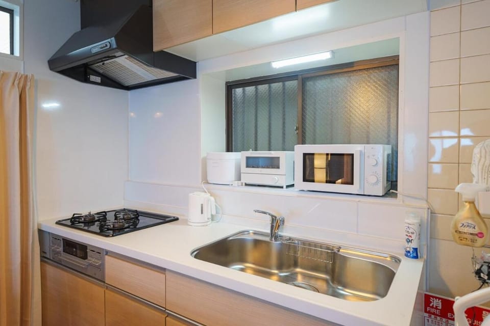 Kitchen or kitchenette, stove, toaster