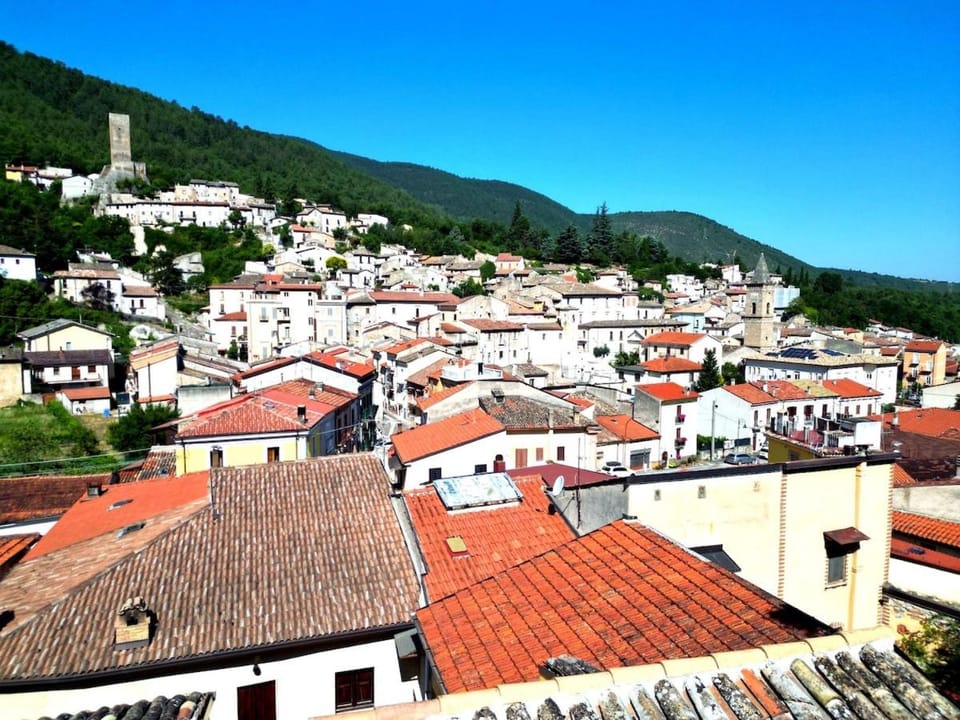 Property building, Day, Neighbourhood, Natural landscape, City view, Mountain view, Street view