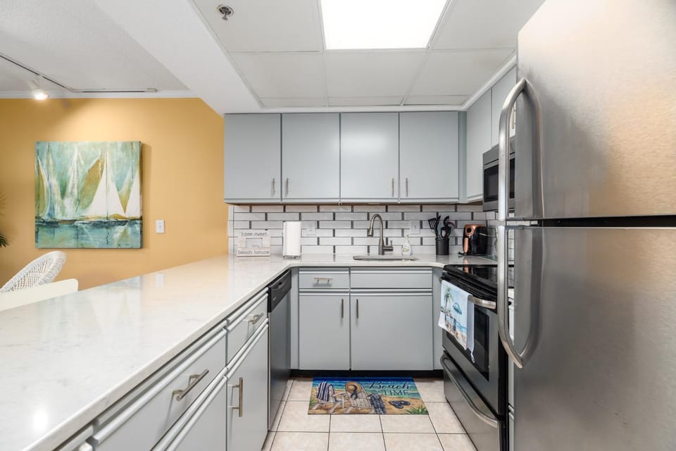 Kitchen or kitchenette, dishwasher, oven, stove