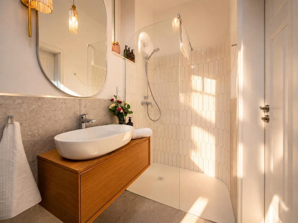 Shower, Toilet, Bathroom, hair dryier, towels, washing machine
