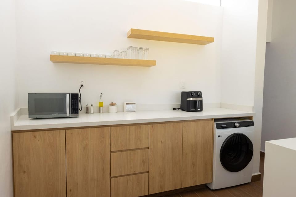 Kitchen or kitchenette, washing machine