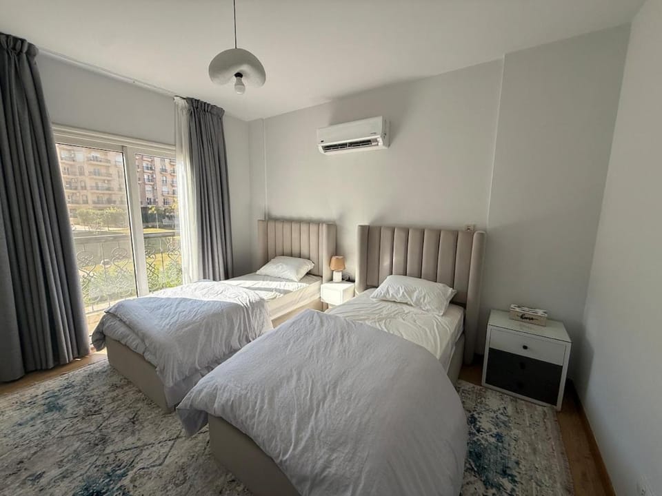 Sunlit 3BR with Green Views Perfect for Families Apartment in New Cairo City