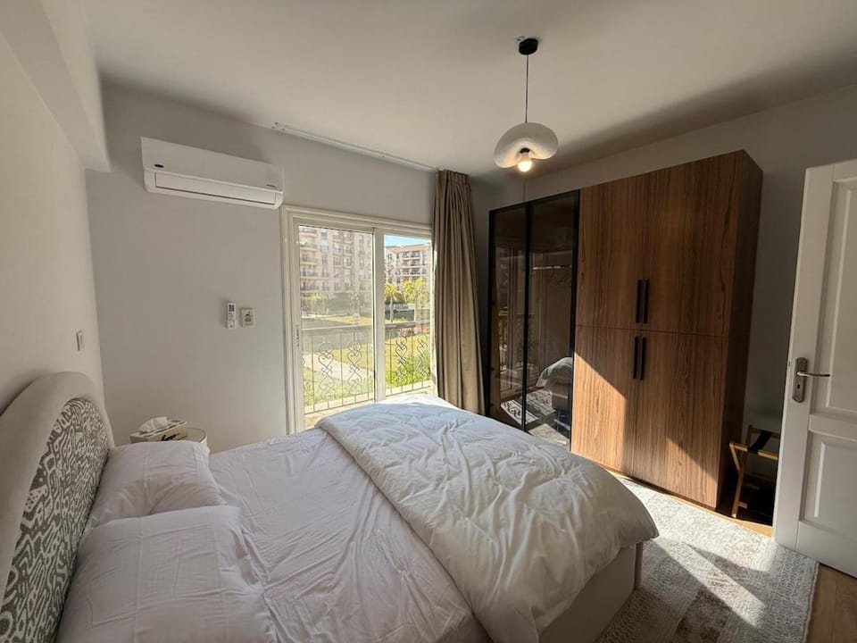 Sunlit 3BR with Green Views Perfect for Families Apartment in New Cairo City