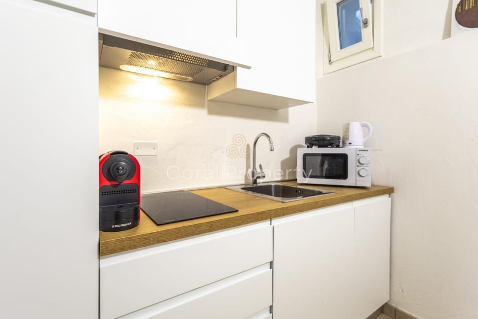 Kitchen or kitchenette, stove, toaster