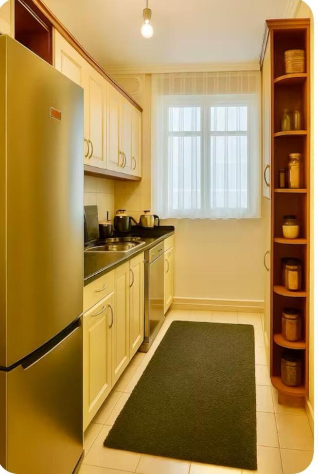 Kitchen or kitchenette, dishwasher, oven, stove