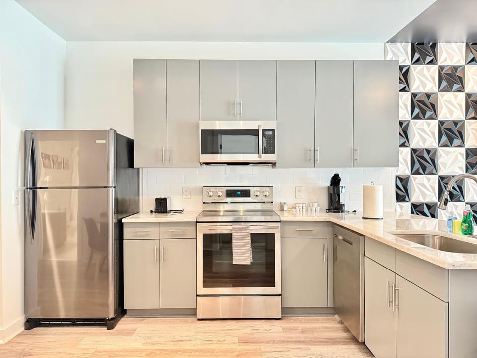 Kitchen or kitchenette, dishwasher, oven, stove, toaster