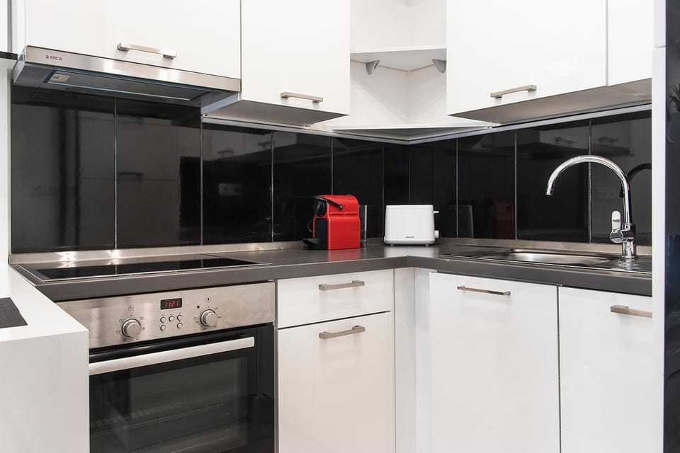Kitchen or kitchenette, dishwasher, stove, toaster