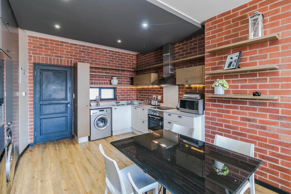 Dining area, microwave, oven, stove, toaster, washing machine, kitchen