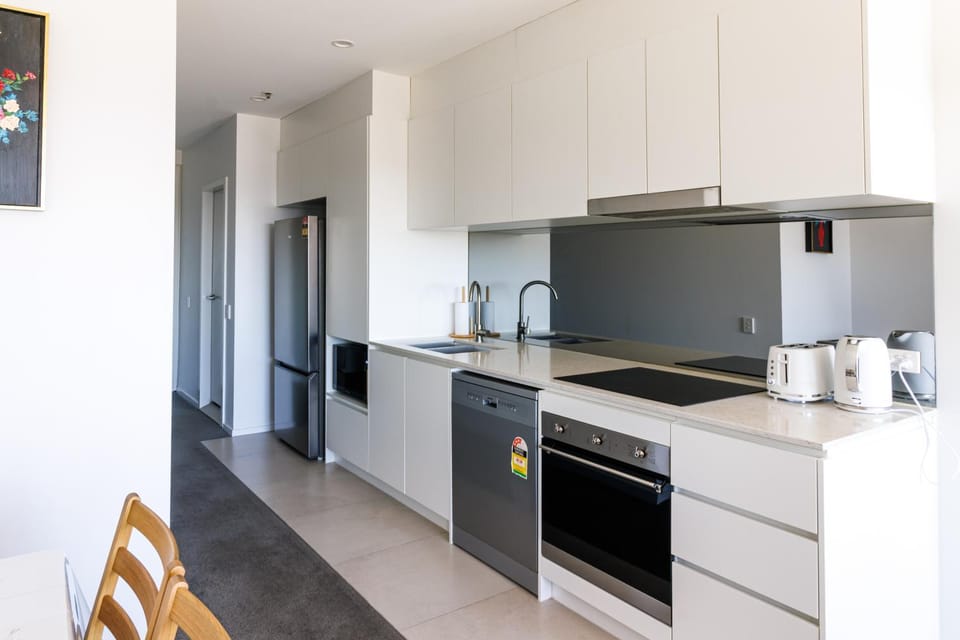 Kitchen or kitchenette, dishwasher, stove, toaster