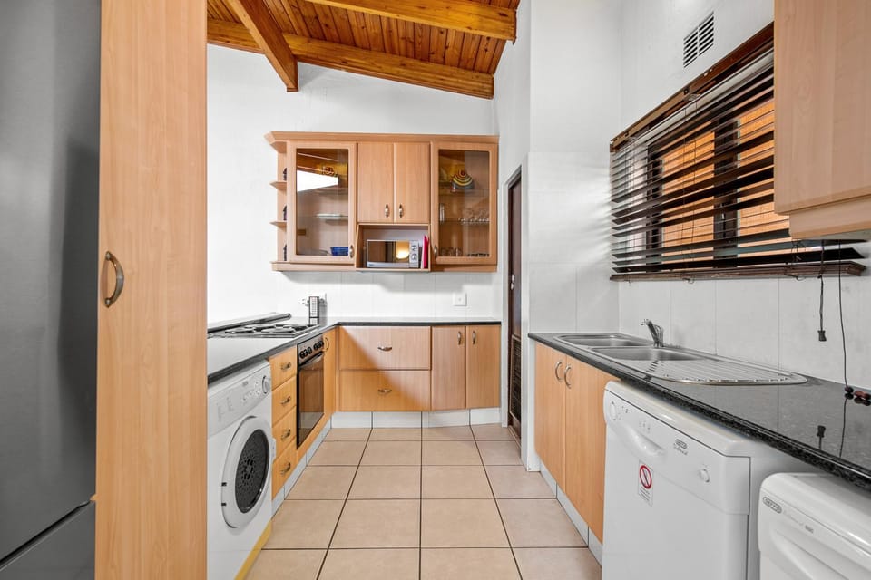 Kitchen or kitchenette, dishwasher, oven, stove, washing machine, dryer