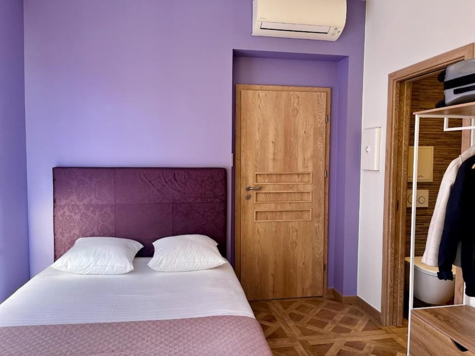 Bed, towels, wardrobe, air conditioner