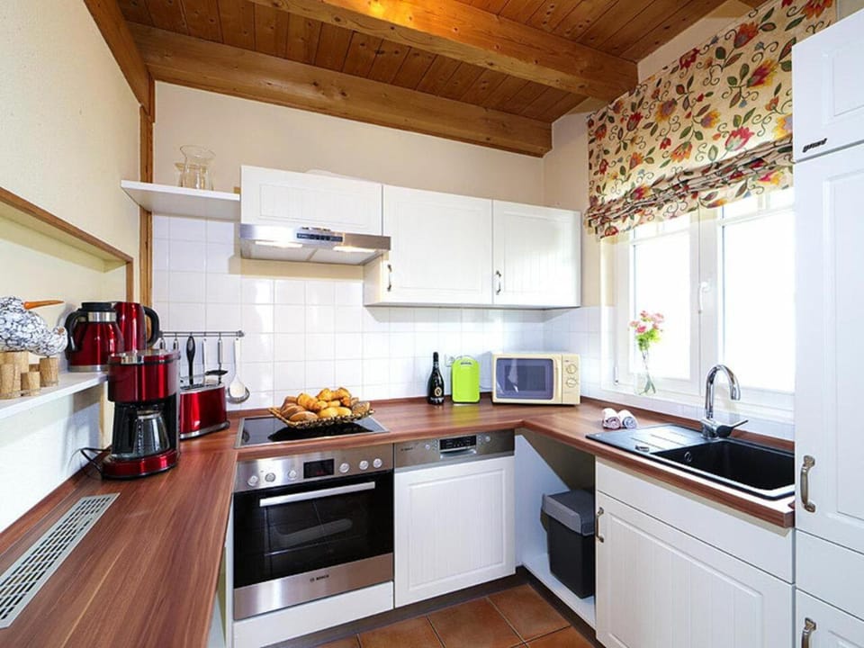 Kitchen or kitchenette, dishwasher, microwave, oven, stove, toaster