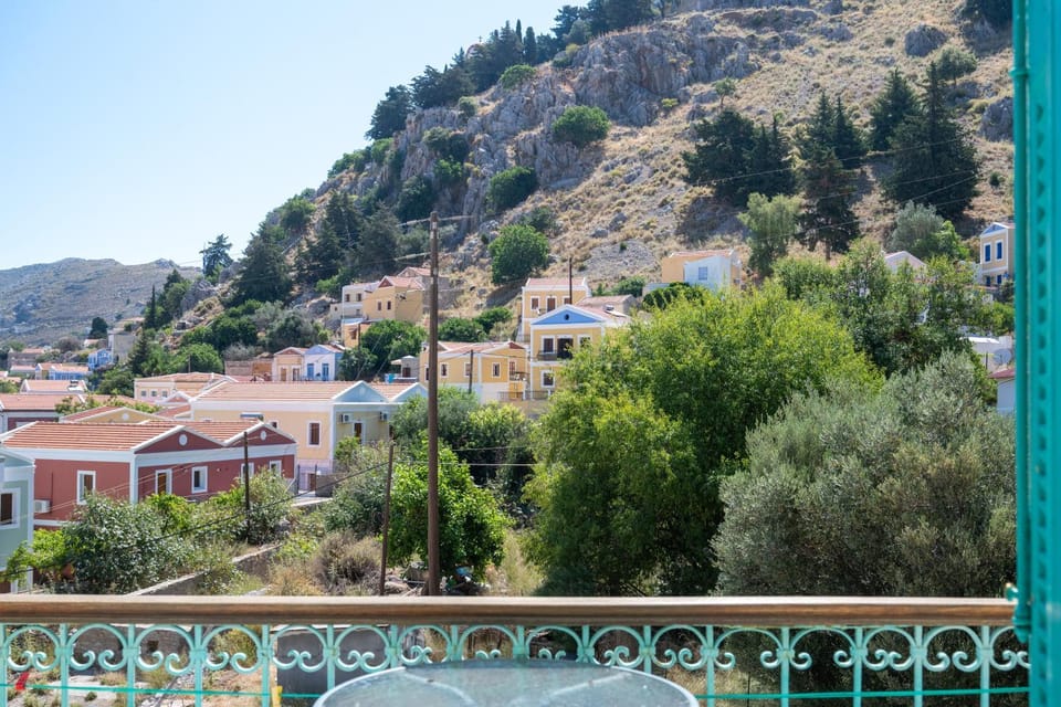 Property building, Nearby landmark, Spring, Day, Neighbourhood, Natural landscape, City view, Mountain view, Street view
