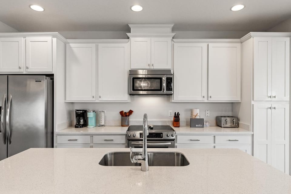 Kitchen or kitchenette, dishwasher, microwave, oven, stove, toaster
