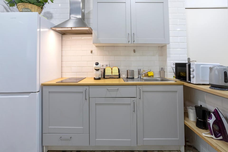 Kitchen or kitchenette, microwave, stove, toaster