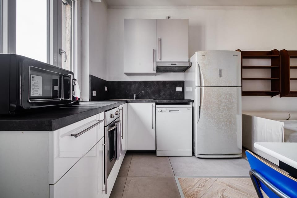 Kitchen or kitchenette, dishwasher, oven, stove