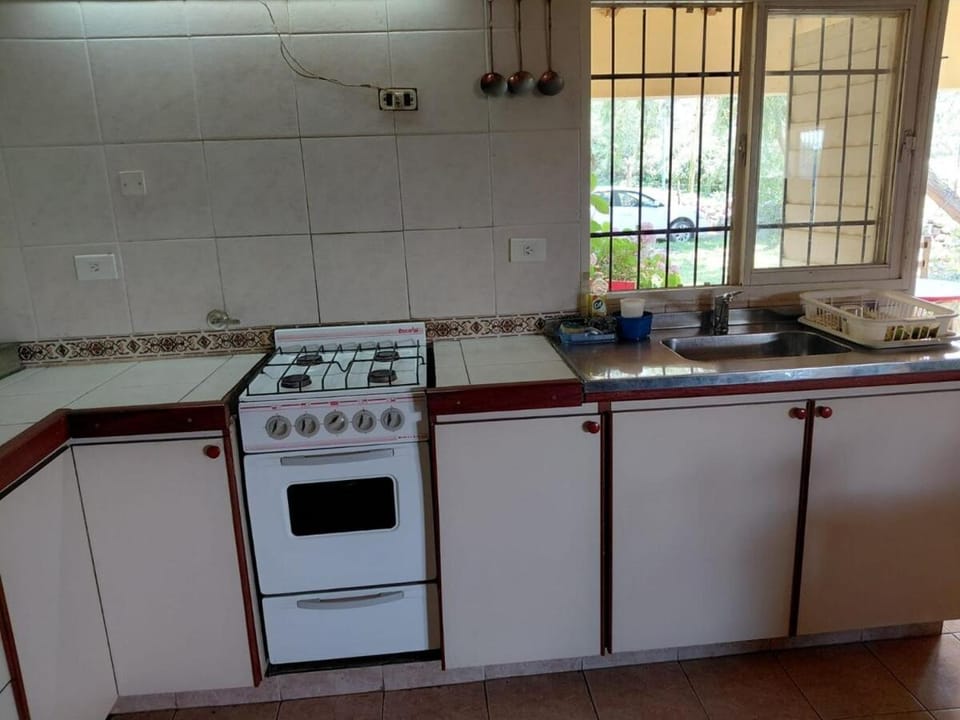 Kitchen or kitchenette, Garden view, dishwasher, stove