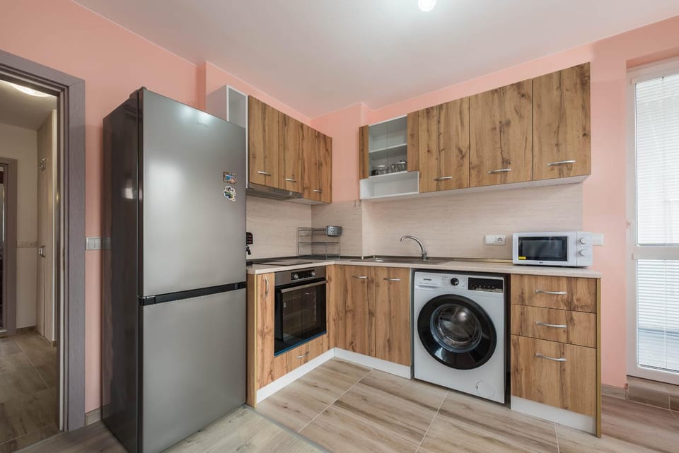 Kitchen or kitchenette, microwave, oven, stove, washing machine