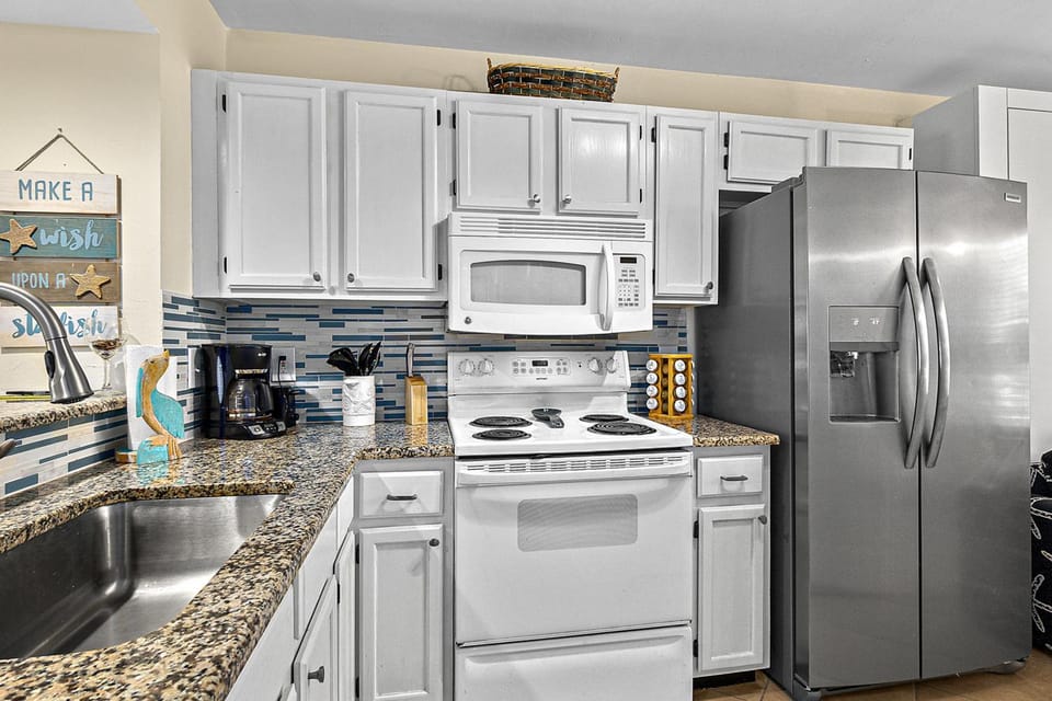 Kitchen or kitchenette, dishwasher, oven, stove, toaster