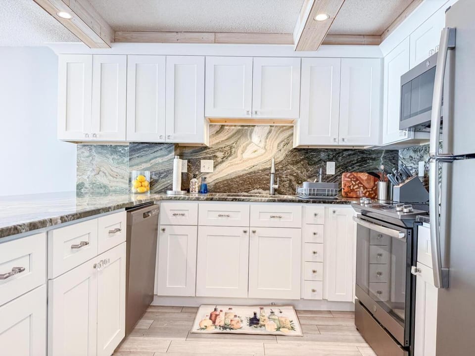 Kitchen or kitchenette, dishwasher, oven, stove, toaster
