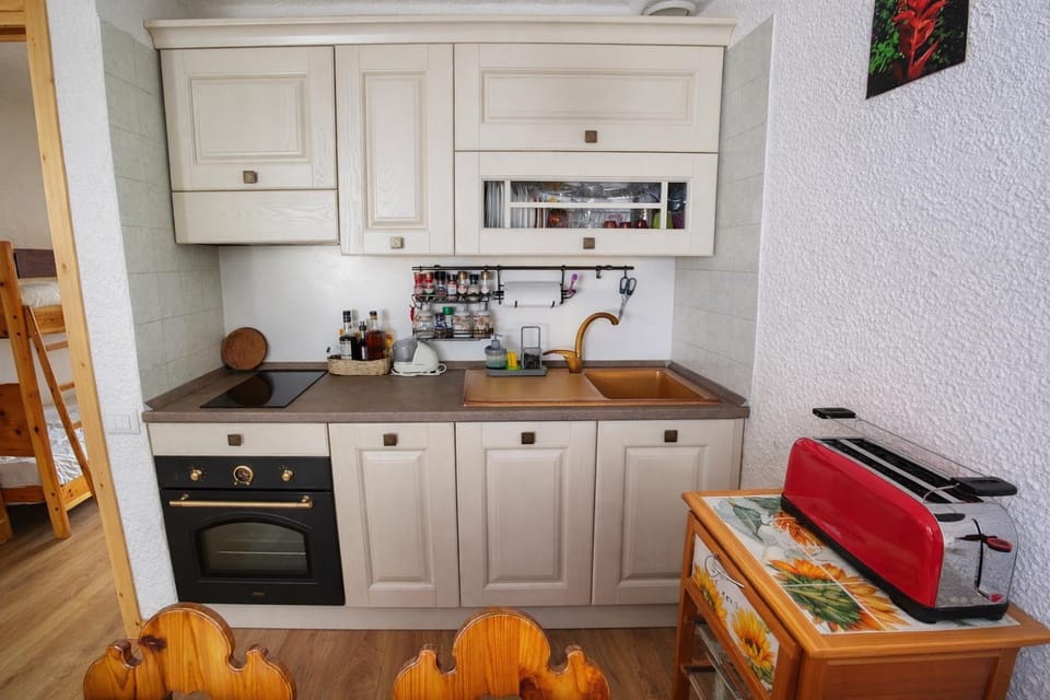 Kitchen or kitchenette, dishwasher, oven, stove, toaster