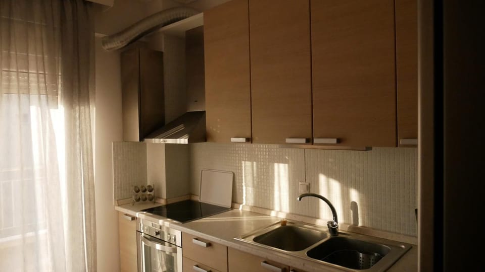 Kitchen or kitchenette, oven, stove