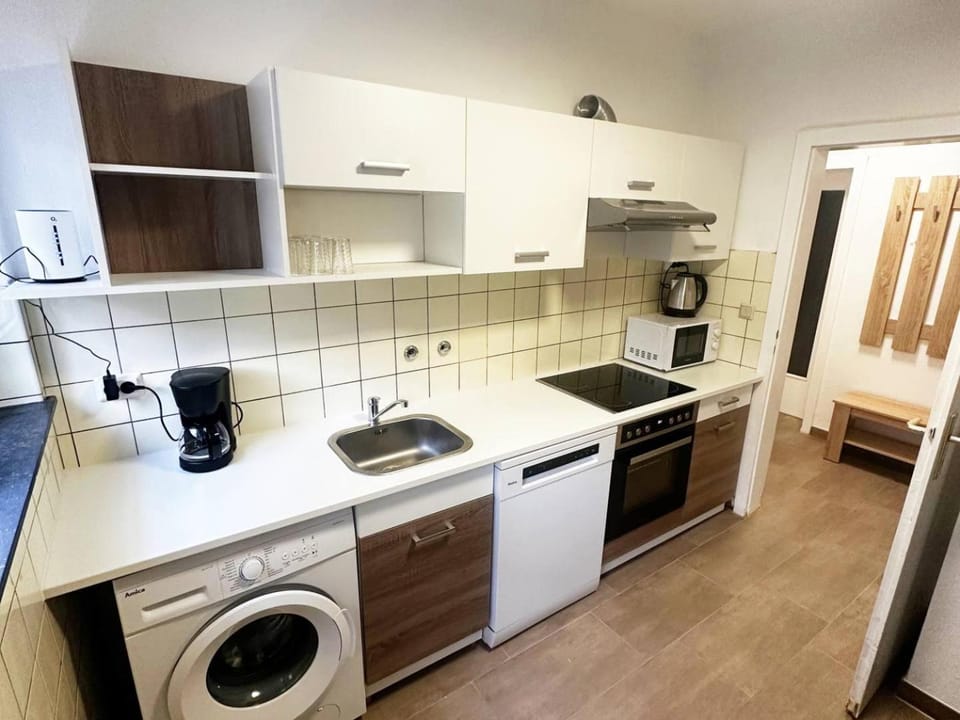 Kitchen or kitchenette, dishwasher, oven, stove, washing machine, dryer, kitchen