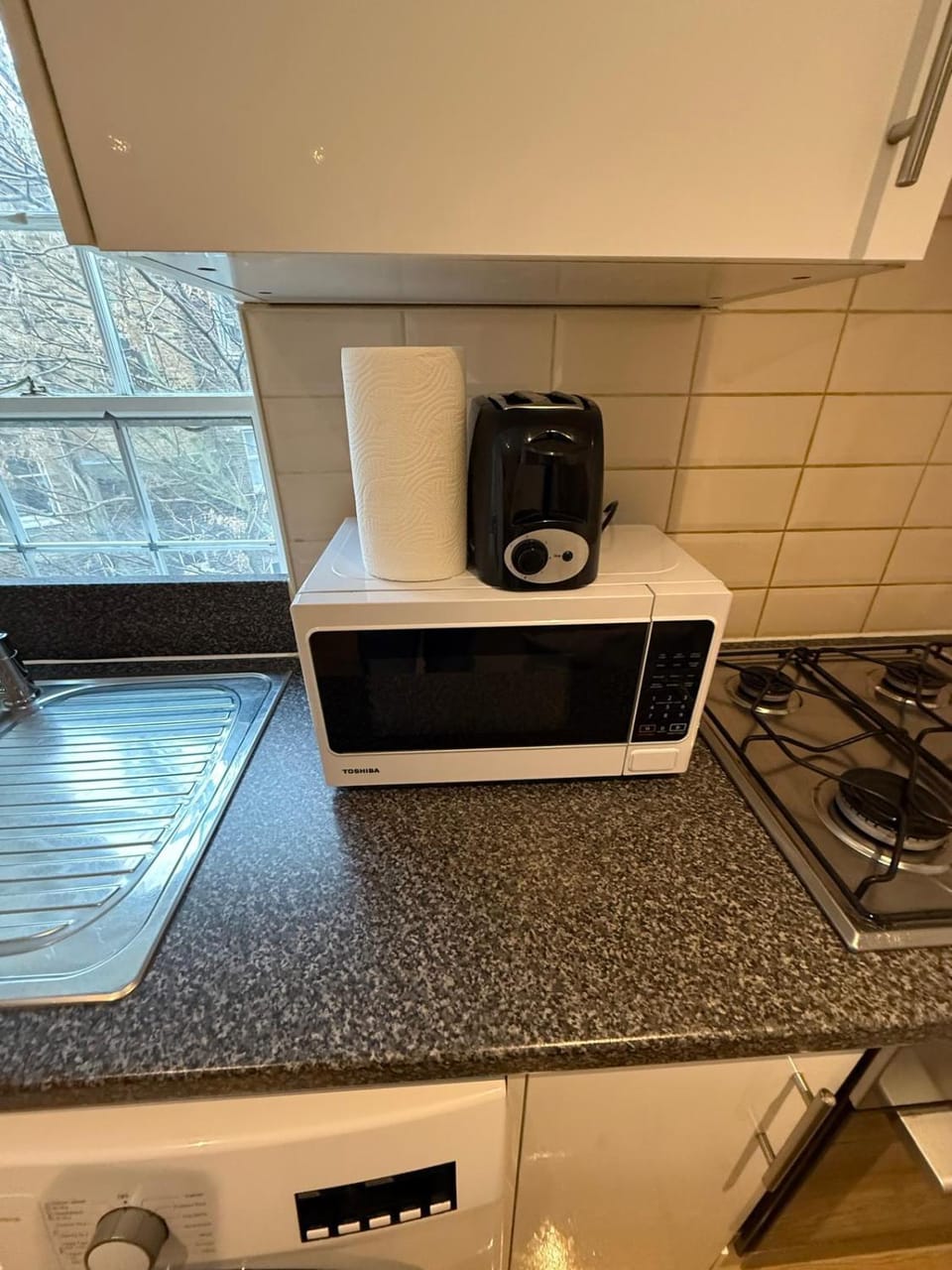 Kitchen or kitchenette, stove, toaster