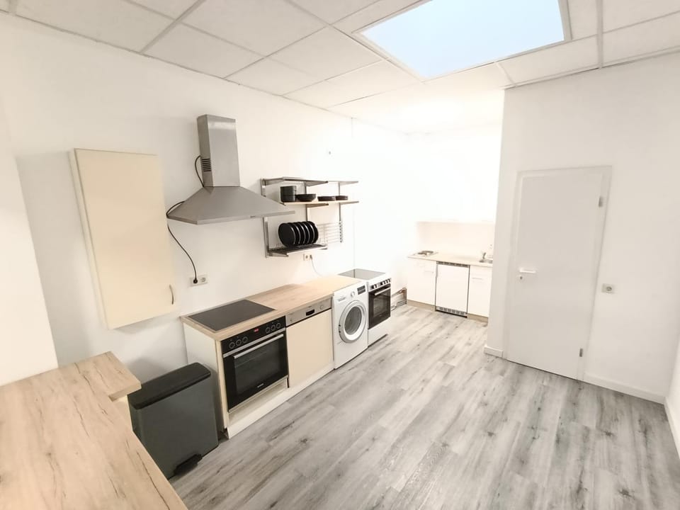 Kitchen or kitchenette, dishwasher, oven, stove, washing machine
