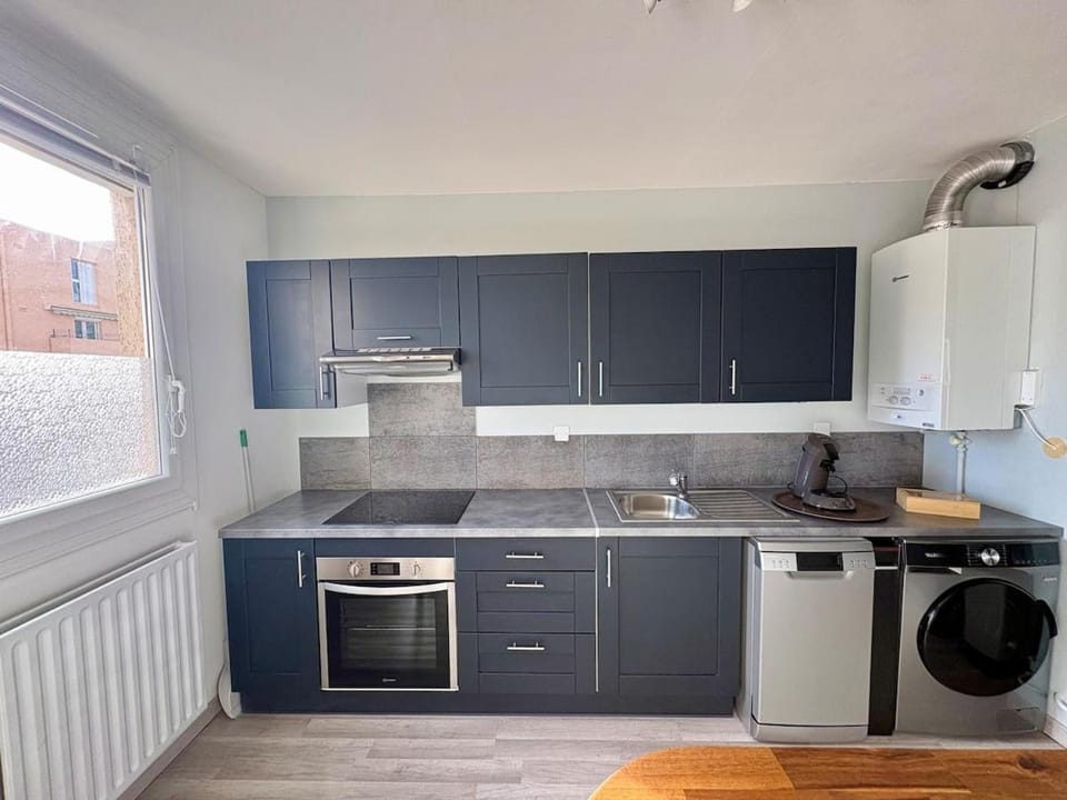 Kitchen or kitchenette, dishwasher, oven, stove, washing machine