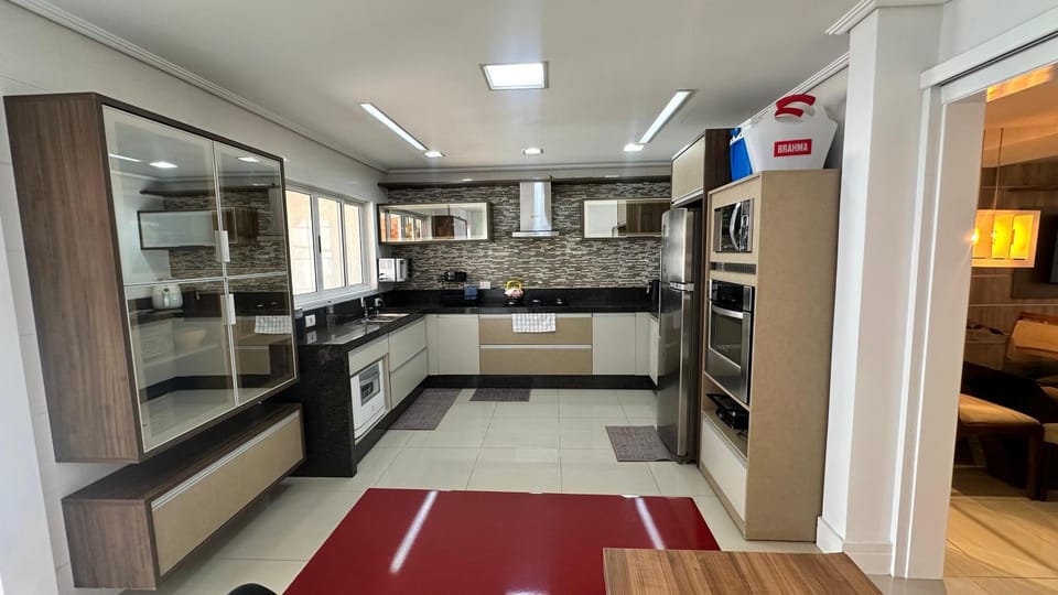 Kitchen or kitchenette, dishwasher, oven, stove
