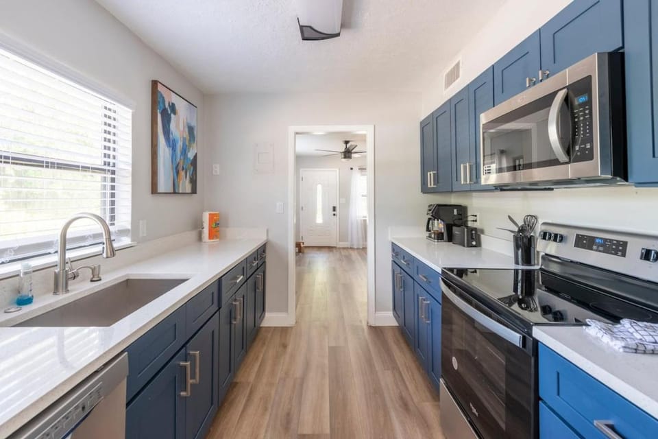 Kitchen or kitchenette, dishwasher, oven, stove