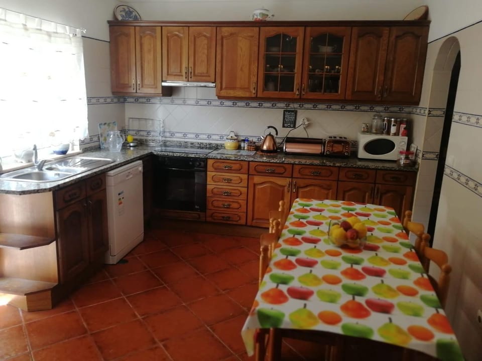 Kitchen or kitchenette, dishwasher, microwave, oven, stove, toaster