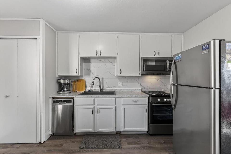 Kitchen or kitchenette, dishwasher, oven, stove, toaster