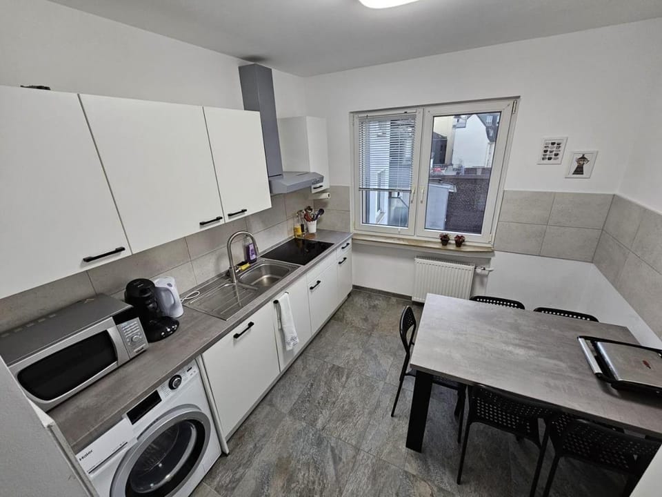 Kitchen or kitchenette, Seating area, Dining area, dishwasher, stove, toaster, washing machine, dryer