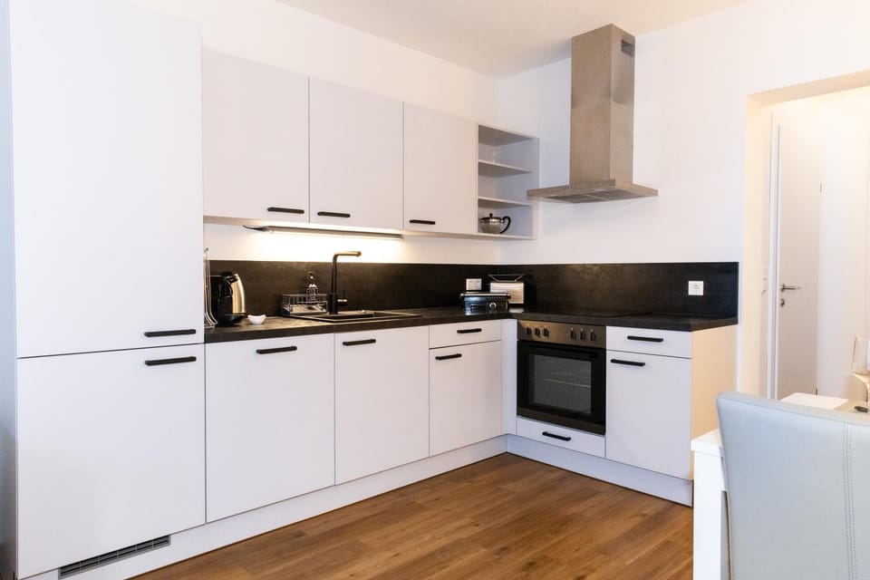 Kitchen or kitchenette, dishwasher, oven, stove, toaster
