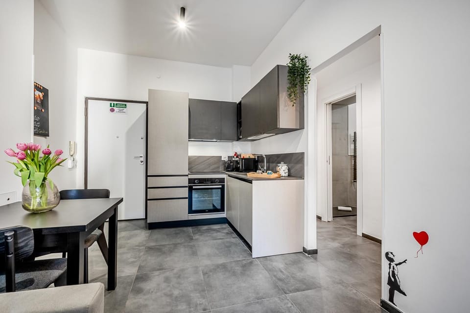 Kitchen or kitchenette, dishwasher, microwave, oven, stove
