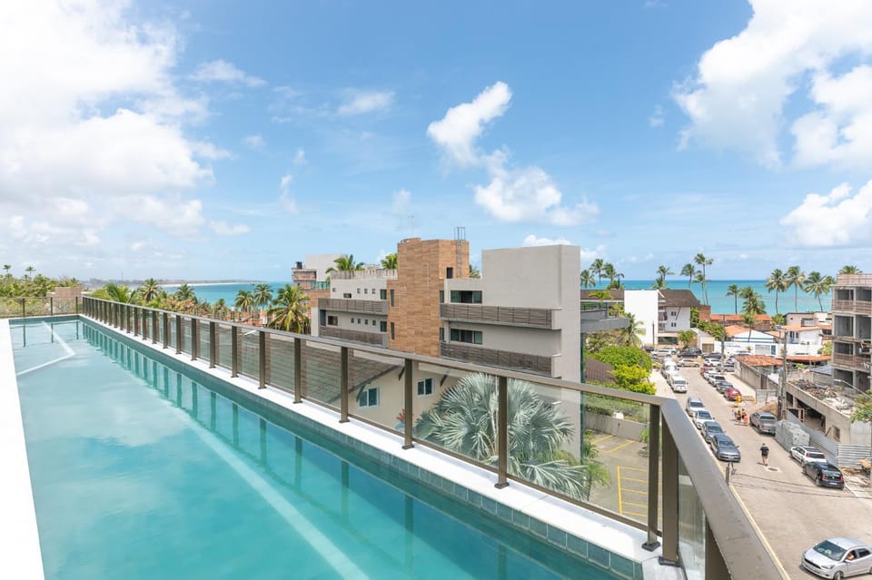 Property building, Day, Neighbourhood, Natural landscape, City view, Pool view, Sea view, Street view, Swimming pool, Swimming pool, Location