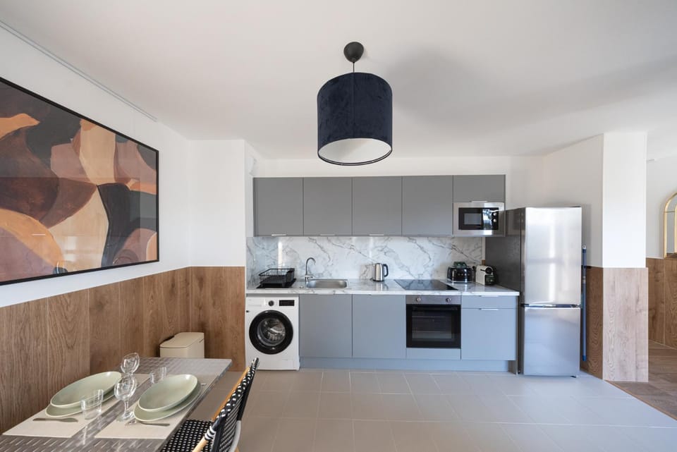 Kitchen or kitchenette, dishwasher, oven, stove, toaster