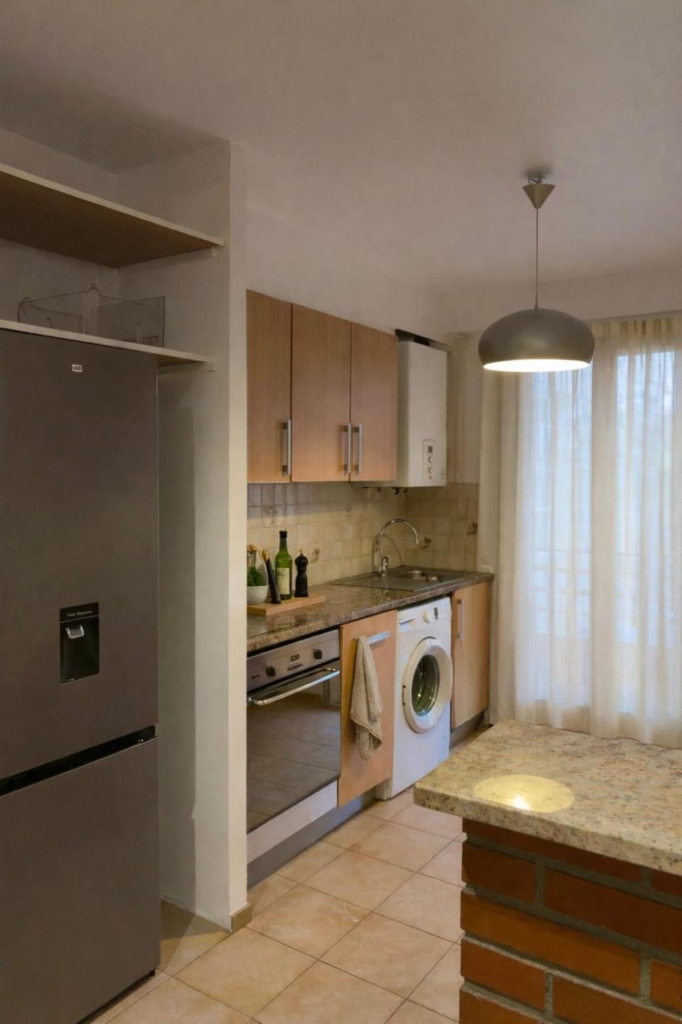 Kitchen or kitchenette, oven, stove, washing machine