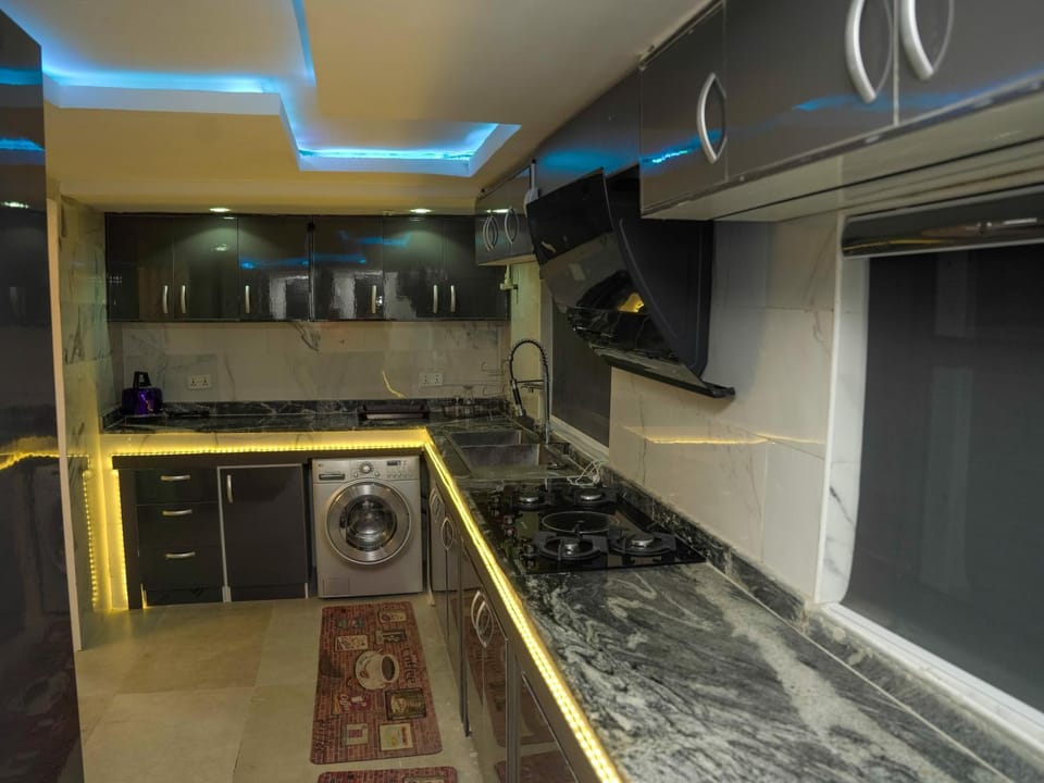Kitchen or kitchenette, washing machine